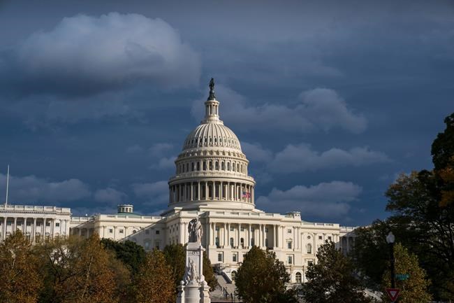 The Capitol is seen beneath dark skies as the House is set to begin public impeachment inquiry hearings as lawmakers debate whether to remove President Donald Trump from office, in Washington, Tuesday, Nov. 12, 2019. (AP Photo/J. Scott Applewhite)