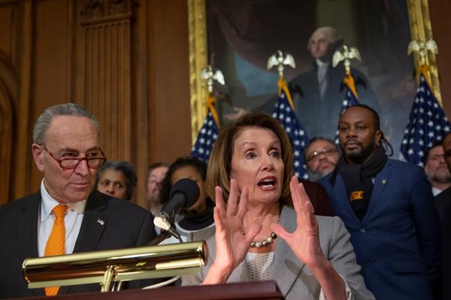 Speaker of the House Nancy Pelosi, D-Calif., and Senate Minority Leader Chuck Schumer, D-N.Y., left, are joined by furloughed federal workers at an event to discuss the impact on families from the partial government shutdown and President Donald Trump's demands for funding a U.S.-Mexico border wall, on Capitol Hill in Washington, Wednesday, Jan. 9, 2019. (AP Photo/J. Scott Applewhite)