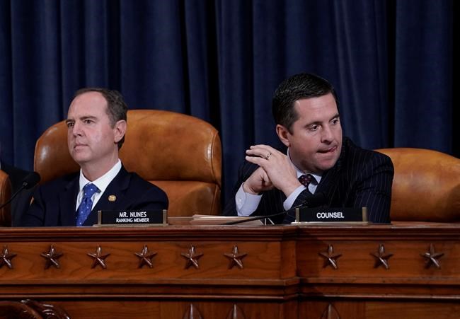 House Intelligence Committee Chairman Adam Schiff, D-Calif., left, with Rep. Devin Nunes, R-Calif, the ranking member, concludes a day of testimony by key witnesses as it probes President Donald Trump's efforts to tie U.S. aid for Ukraine to investigations of his political opponents, on Capitol Hill in Washington, Wednesday, Nov. 20, 2019. (AP Photo/J. Scott Applewhite)