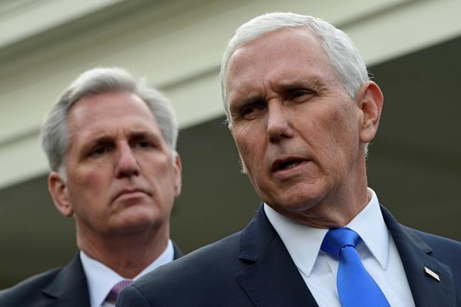 Vice President Mike Pence, right, standing with House Minority Leader Kevin McCarthy of Calif., left, speaks to reporters following a meeting with President Donald Trump and Democratic congressional leaders at the White House in Washington, Wednesday, Jan. 9, 2019. (AP Photo/Susan Walsh)