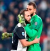 Juventus Gonzalo Higuain and Milans Gianluigi Donnarumma in action during the italian Serie A soccer match Juventus FC vs AC Milan at Allianz stadium in Turin, Italy, Sunday, November 10, 2019. (Alessandro Di Marco/ANSA via AP)