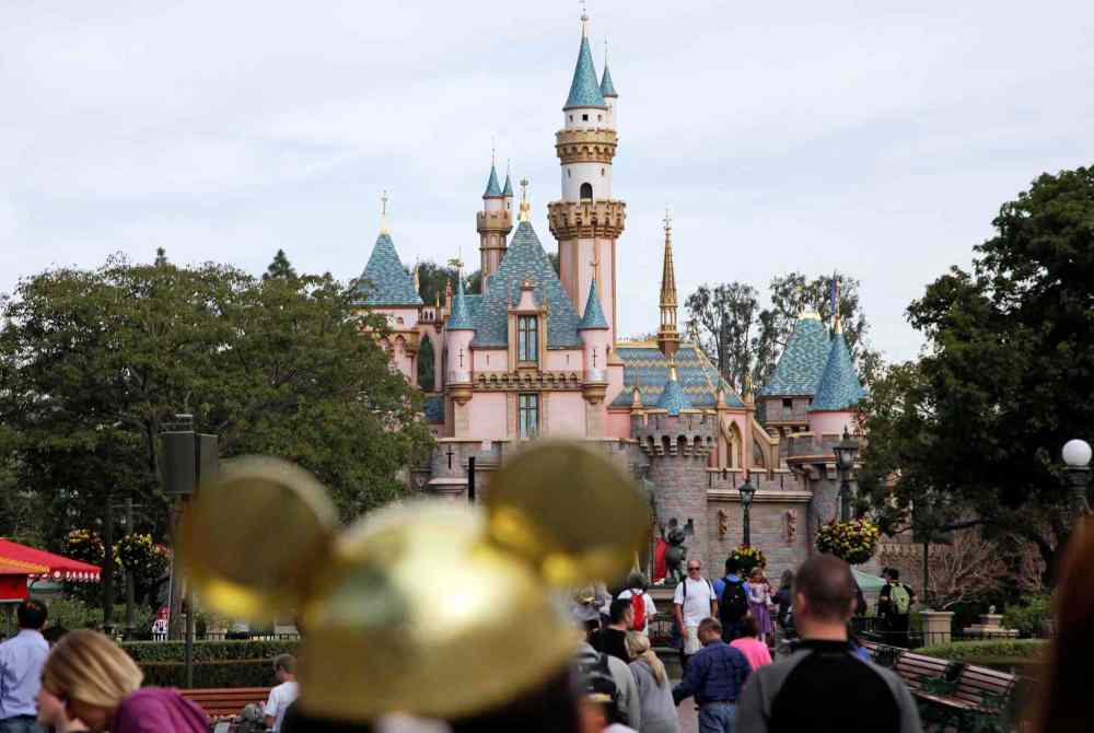 Jae C. Hong / The Associated Press
In this Jan. 22, 2015 file photo, visitors walk toward the Sleeping Beauty's Castle in the background at Disneyland Resort in Anaheim.