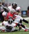 Dave Martin / Associated Press files
Winston Salem State receiver Jamal Williams is taken down by Valdosta State defenders Jeremy Grable (35), Matt Pierce (left) and Lance Holder, rear, in the first half of an NCAA Div II national championship college football game in Florence, Ala., in December 2012.