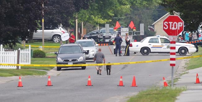 Police gather evidence outside of a house in Strathroy Ontario, Thursday, August 11, 2016. Terrorism suspect Aaron Driver was killed in a confrontation with police in the southern Ontario town of Strathroy. THE CANADIAN PRESS/ Dave Chidley