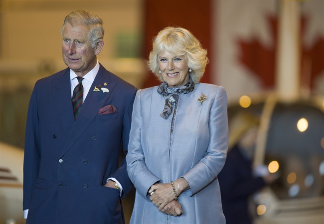 Prince Charles and wife Camilla look on in Winnipeg on Wednesday, May 21, 2014. THE CANADIAN PRESS/David Lipnowski