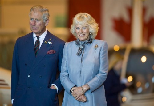 Prince Charles and wife Camilla look on in Winnipeg on Wednesday, May 21, 2014. THE CANADIAN PRESS/David Lipnowski