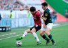 Wolfsburg's Josip Brekalo, right, and Hannover's Genki Haraguchi challenge for the ball during the Bundesliga soccer match between VfL Wolfsburg and Hannover 96 in Wolfsburg, Germany, Saturday, April 6, 2019. (Peter Steffen/dpa via AP)