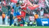 Berlin's Mathew Leckie, left, and Duesseldorf's Matthias Zimmermann challenge for the ball during the Bundesliga soccer match between Hertha BSC Berlin and Fortuna Duesseldorf in Berlin, Germany, Saturday, April 6, 2019. (Andreas Gora/dpa via AP)