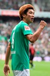 Bremen's Yuya Osako celebrates after scoring during the Bundesliga soccer match between Werder Bremen and FC Augsburg in Bremen, Germany, Sunday, Sept. 1, 2019. (Carmen Jaspersen/dpa via AP)