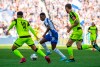In this Saturday, Sept. 21, 2019 photo, Berlin's Javairo Dilrosun, center, challenges for the ball with Paderborn's Cauly Oliveira Souza, left, and Christian Strohdiek, right, during the German Bundesliga soccer match between Hertha BSC Berlin and SC Paderborn 07, at the Olympic Stadion in Berlin. ( Soeren Stache/dpa via AP)