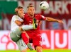 Munich's Joshua Kimmich, left, and Felix Bruegmann, right, from Cottbus challenge for the ball during the German soccer cup, DFB Pokal, first Round match between FC Energie Cottbus and FC Bayern Munich in Cottbus, Germany, Monday, Aug. 12, 2019. (Robert Michael/dpa via AP)