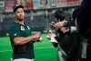Oakland Athletics pitcher Frankie Montas gives his autograph to fans prior to their pre-season exhibition baseball game against the Nippon Ham Fighters at Tokyo Dome in Tokyo Monday, March 18, 2019. (AP Photo/Eugene Hoshiko)