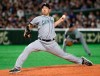 Seattle Mariners starter Yusei Kikuchi pitches against the Oakland Athletics in the first inning of Game 2 of their Major League baseball opening series at Tokyo Dome in Tokyo, Thursday, March 21, 2019. (AP Photo/Koji Sasahara)