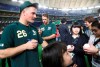 Oakland Athletics third baseman Matt Chapman (26) gives his autographs to fans prior to Game 1 of a Major League opening series baseball game between the Seattle Mariners and the Athletics at Tokyo Dome in Tokyo, Wednesday, March 20, 2019 in Tokyo, (AP Photo/Koji Sasahara)