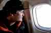 DYLAN ROBERTSON / WINNIPEG FREE PRESS
Remi Foubert-Allen looks out the window of a propeller plane, somewhere between Churchill and Gillam, where the sections of the Hudson Bay Railway washed out this spring.