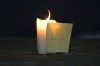 A candle and note with the name of slain reservist Nathan Cirillo of Hamilton, Ont., shown on the curb of a road near the National War Memorial in Ottawa on Wednesday, Octobe 22, 2014. THE CANADIAN PRESS/Sean Kilpatrick