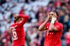 In this Saturday, Oct. 5, 2019 photo Bayern's player Serge Gnabry, right, reacts after the German Bundesliga socvcer match between FC Bayern Munich and 1899 Hoffenheim in Munich, Germany. Bayern Munich’s first defeat of the season has exposed old problems that a 7-2 rout of Tottenham had helped cover up only days before. (Matthias Balk/dpa via AP)