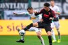 Gladbach's Stefan Lainer, left, and Augsburg's Ruben Vargas, right, challenge for the ball during the German Bundesliga soccer match between Borussia Moenchengladbach and FC Augsburg in Moenchengladbach, Germany, Sunday, Oct. 6, 2019. (Marius Becker/dpa via AP)
