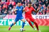 Hoffenheim's Sargis Adamyan, left, and Bayern's Jerome Boateng, right, challenge for the ball during the German Bundesliga soccer match between FC Bayern Munich and 1899 Hoffenheim in Munich, Germany, Saturday, Oct. 5, 2019. (Matthias Balk/dpa via AP)