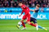 Leverkusen's Kai Havertz, left, and Moenchengladbach's Nico Elvedi, right, challenge for the ball during the German Bundesliga soccer match between Bayer 04 Leverkusen and Borussia Moenchengladbach in Leverkusen, Germany, Saturday, Nov. 2, 2019. (Marius Becker/dpa via AP)