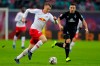 Leipzig's Lukas Klostermann, left, and Bremen's Kevin Moehwald, right, challenge for the ball during the German Bundesliga soccer match between RB Leipzig and SV Werder Bremen in Leipzig, Germany, Saturday, Dec. 22, 2018. (Jan Woitas/dpa via AP)