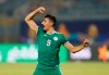 Algeria's Baghdad Bounedjah celebrates at the end of the African Cup of Nations group C soccer match between Algeria and Senegal at 30 June Stadium in Cairo, Egypt, Thursday, June 27, 2019. (AP Photo/Ariel Schalit)