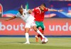 Morocco's Hakim Ziyach, right, and Namibia's Riaan Hanamub fight for the ball during the African Cup of Nations group D soccer match between Morocco and Namibia in Al Salam Stadium in Cairo, Egypt, Sunday, June 23, 2019. (AP Photo/Ariel Schalit)