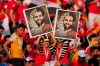Egyptian fans hold posters of their star striker Mohamed Salah prior to the African Cup of Nations group A soccer match between Egypt and Uganda in Cairo International Stadium in Cairo, Egypt, Sunday, June 30, 2019. (AP Photo/Hassan Ammar)