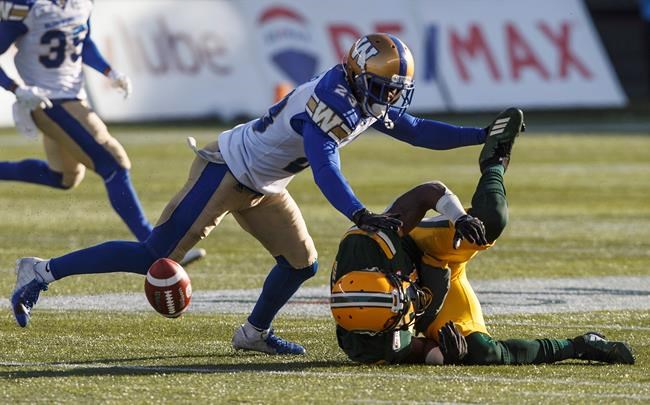 JASON FRASON / THE CANADIAN PRESS
Winnipeg Blue Bombers Anthony Gaitor (23) tackles Edmonton Eskimos Godfrey Onyeka (23) during first half CFL action in Edmonton, Alta., on Saturday November 3, 2018.