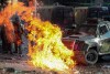 A petrol bomb explodes in front of a police armored vehicle during a protest in Santiago, Chile, Tuesday, Nov. 12, 2019. Students in Chile began protesting nearly a month ago over a subway fare hike. The demonstrations have morphed into a massive protest movement demanding improvements in basic services and benefits, including pensions, health, and education. (AP Photo/Esteban Felix)