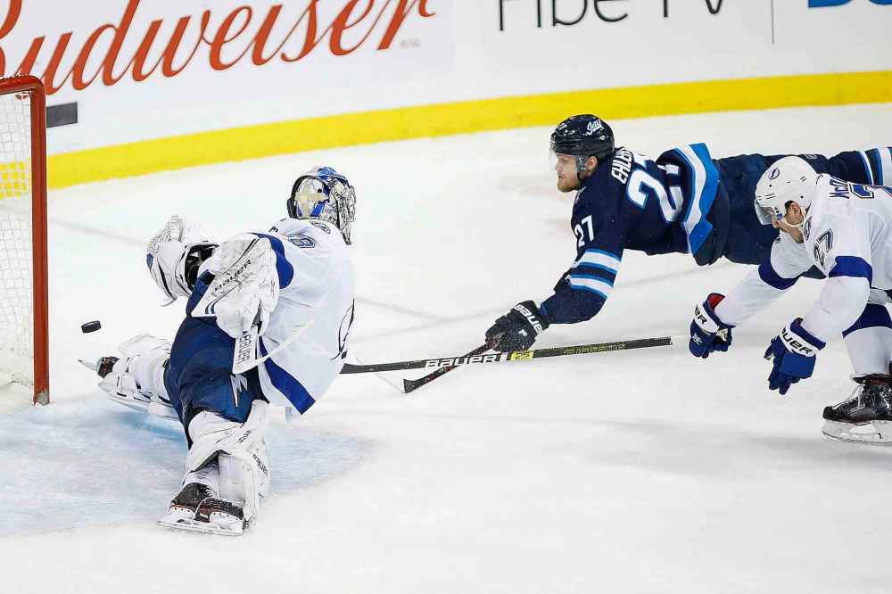 THE CANADIAN PRESS/John Woods
Winnipeg Jets' Nikolaj Ehlers scores the game-tying goal on Tampa Bay Lightning goaltender Andrei Vasilevskiy during the third period in Winnipeg on Sunday.