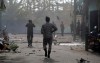 Sri Lankan security forces approach the site after a vehicle parked near St. Anthony's shrine exploded in Colombo, Sri Lanka, Monday, April 22, 2019. Easter Sunday bombings that ripped through churches and luxury hotels killed more than 200 people.(AP Photo/Eranga Jayawardena)
