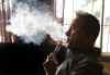 Ben Margot / The Associated Press
Geoff Braithwaite, owner of Tasty Vapor in Oakland, Calif., exhales vapor after using an electronic cigarette in a file photo.