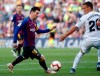 Barcelona forward Lionel Messi fights for the ball against Getafe's Nemanja Maksimovic during the Spanish La Liga soccer match between FC Barcelona and Getafe at the Camp Nou stadium in Barcelona, Spain, Sunday, May 12, 2019. (AP Photo)