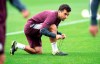 In this photo released by Villarreal Club de Futbol on Tuesday, Oct. 15, 2019, Giuseppe Rossi laces up his sneakers during a training with Spanish club Villarreal, Spain. The 32-year old Rossi, the American-born striker who played for the Italian national team before a series of injuries slowed his career, is back at Villarreal, the Spanish club where he thrived in his prime. (Villareal F.C via AP)
