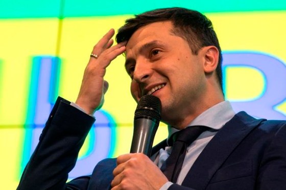 Ukrainian comedian Volodymyr Zelenskiy, reacts as he responds to a journalist question during a press conference, after the presidential elections in Kiev, Ukraine, Sunday, March. 31, 2019. Exit polls indicated Zelenskiy would get about 30 percent of the vote, far short of the absolute majority needed to win the first round. Most exit polls said incumbent Petro Poroshenko received the second-biggest support, which would put him and Zelenskiy in a runoff on April 21. (AP Photo/Emilio Morenatti)