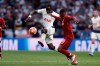 Tottenham's Moussa Sissoko fights for the ball against Liverpool's Daniel Sturridge during the Champions League final soccer match between Tottenham Hotspur and Liverpool at the Wanda Metropolitano Stadium in Madrid, Saturday, June 1, 2019. (AP Photo/Manu Fernandez)