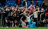 Ajax players celebrate after wining the game, at the end of the Champions League soccer match between Real Madrid and Ajax at the Santiago Bernabeu stadium in Madrid, Spain, Tuesday, March 5, 2019. (AP Photo/Manu Fernandez)