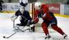 Wayne Glowacki / Winnipeg Free Press
Winnipeg Jet Eric Fehr (red jersey) sweeps around Jets goalie Chris Mason at the MTS Iceplex, practising with his teammates.