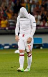 England's Wayne Rooney reacts after losing the penalty shootout of the Euro 2012 soccer championship quarterfinal match between England and Italy in Kiev, Ukraine, Monday, June 25, 2012. (AP Photo/Michael Sohn)