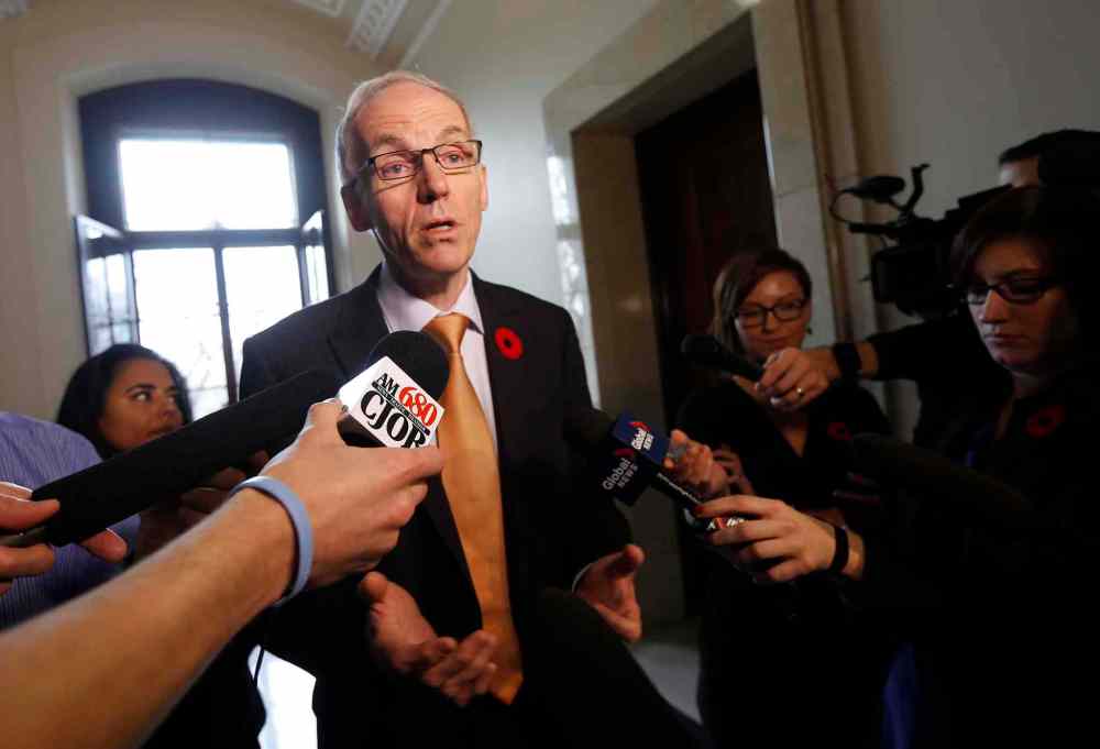 KEN GIGLIOTTI / WINNIPEG FREE PRESS
Steve Ashton, outside the NDP cabinet room, announces the throne speech will be Nov. 20.