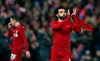 Liverpool forward Mohamed Salah, right, applauds after his team won the Champions League Group C soccer match between Liverpool and Napoli at Anfield stadium in Liverpool, England, Tuesday, Dec. 11, 2018.(AP Photo/Dave Thompson)