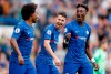 Chelsea's Jorginho, center , Chelsea's Tammy Abraham, right, and Chelsea's Willian celebrate after scoring their side's first goal during the English Premier League soccer match between Chelsea and Brighton & Hove Albion at Stamford Bridge stadium in London, Saturday, Sept. 28, 2019.(AP Photo/Frank Augstein)