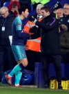 Tottenham's Son Heung-min, left, speaks to Tottenham's coach Mauricio Pochettino as he leaves the pitch during the English FA Cup third round soccer match between Tranmere Rovers and Tottenham Hotspur at Prenton Park stadium in Birkenhead, England, Friday, Jan. 4, 2019.(AP Photo/Jon Super)