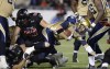 Justin Tang / THE CANADIAN PRESS/
Winnipeg Blue Bombers' Drew Willy (5) is taken down by the Ottawa Redblacks during first half of CFL action in Ottawa on Friday.