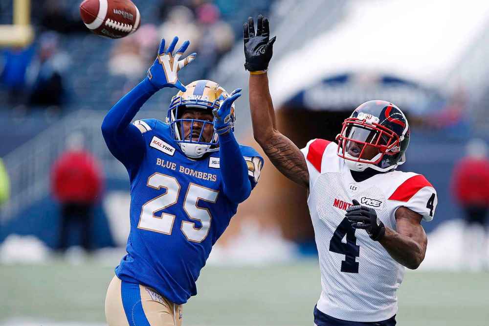 JOHN WOODS / THE CANADIAN PRESS
Winnipeg Blue Bombers' Nick Taylor (25) intercepts the pass intended for Montreal Alouettes' Quan Bray (4) during the second half of CFL action in Winnipeg, Saturday, Oct. 12, 2019.
