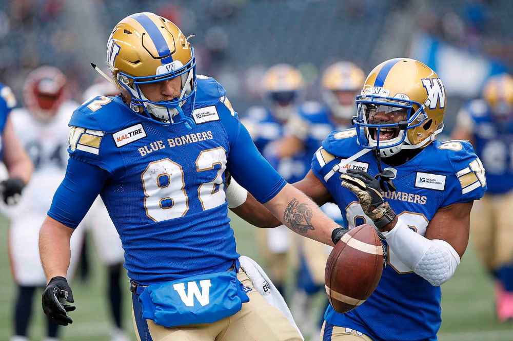 JOHN WOODS / THE CANADIAN PRESS
Winnipeg Blue Bombers' Drew Wolitarsky (82) celebrates his touchdown with teammate Rasheed Bailey (88) during the first half.