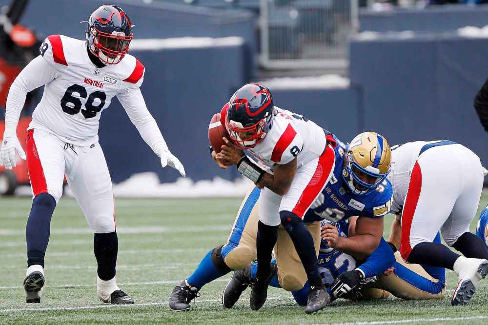 JOHN WOODS / THE CANADIAN PRESS
Winnipeg Blue Bombers' Steven Richardson (98) sacks Montreal Alouettes quarterback Vernon Adams Jr. (8) during the first half.
