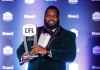 THE CANADIAN PRESS/Jason Franson.
Winner of Most Outstanding Offensive Lineman, Winnipeg Blue Bombers Stanley Bryant holds his award, during the Shaw CFL Awards in Edmonton on Thursday.