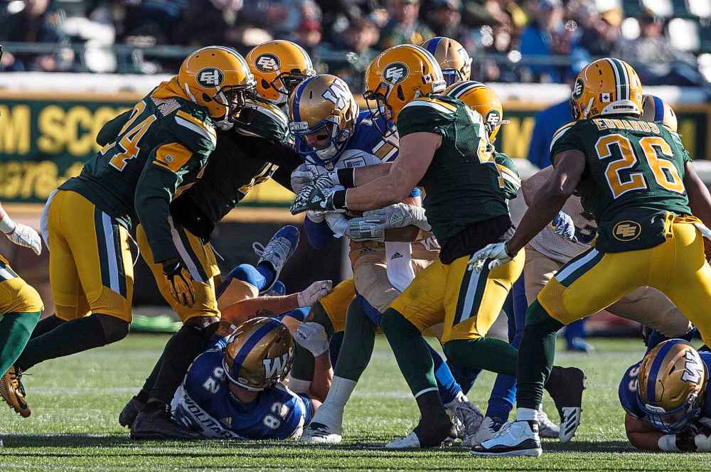 JASON FRASON / THE CANADIAN PRESS
Winnipeg Blue Bombers quarterback Chris Streveler (17) is tackled by the Edmonton Eskimos during first half CFL action in Edmonton, Alta., on Saturday November 3, 2018.